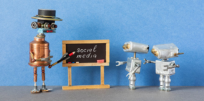 A robot teacher teaching two students in front of a blackboard that reads “social media.”