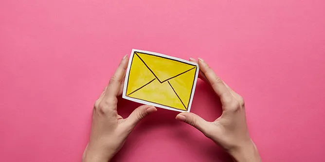 yellow paper envelop on pink background - represent subject line of emails