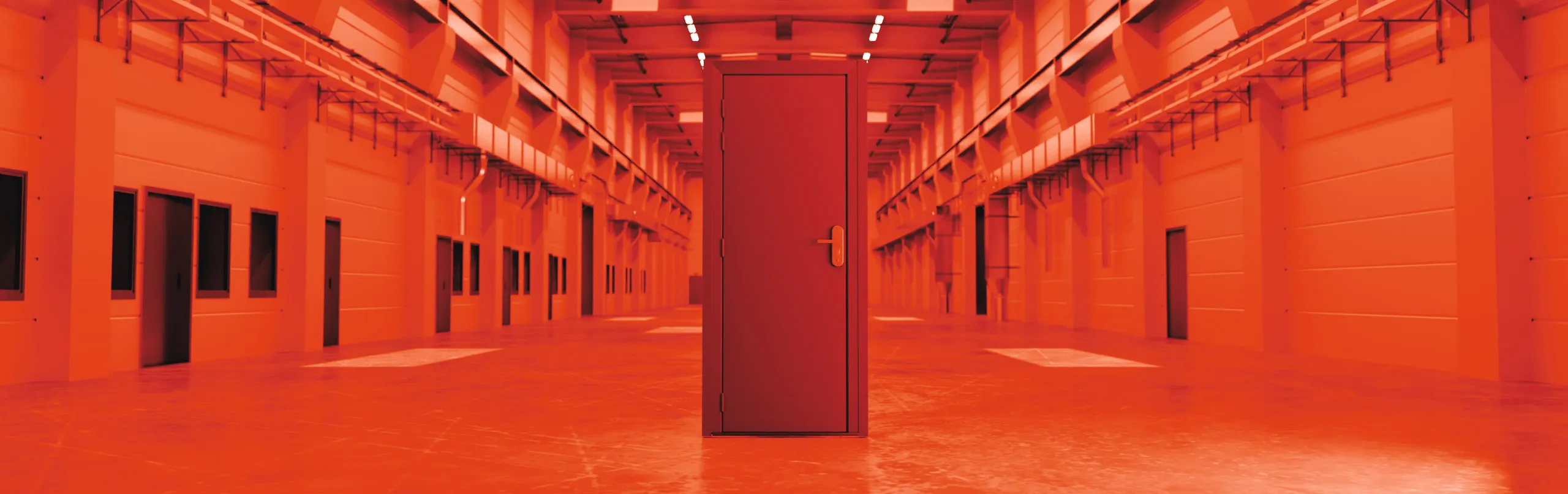 A single red door without any walls is standing in the centre of a long red corridor that has windows and doors lining both walls.