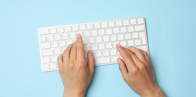 white keyboard on blue background